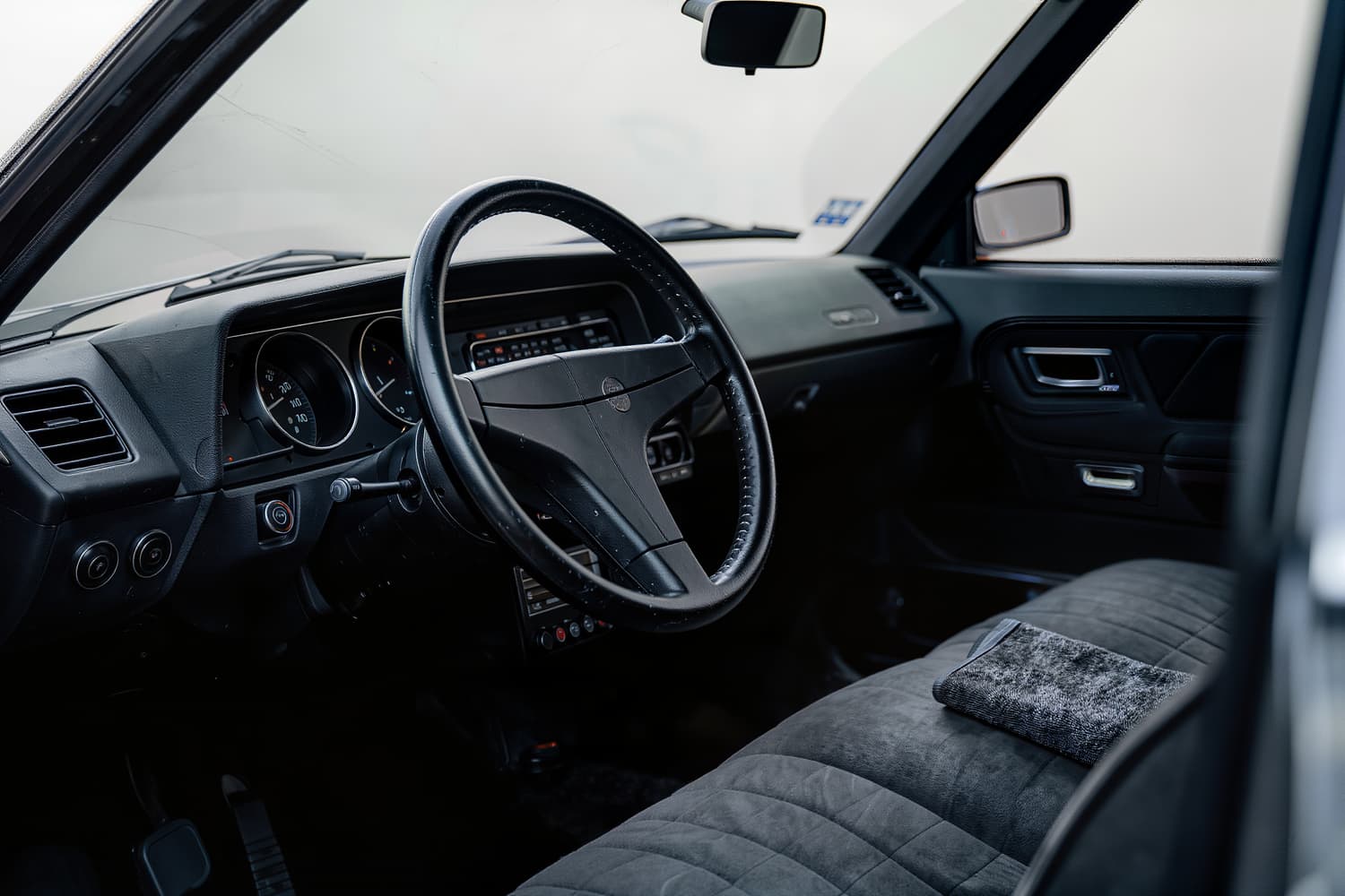 Cleaned dashboard, vents and centre console inside a car cabin in soft morning light