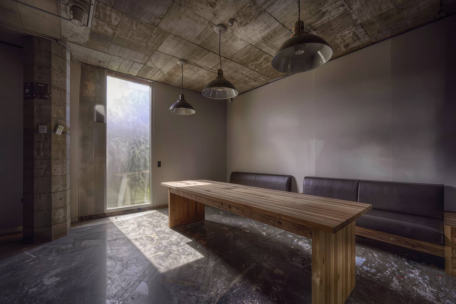 A ground-floor amenity lounge at handover with furniture placed and lights on.