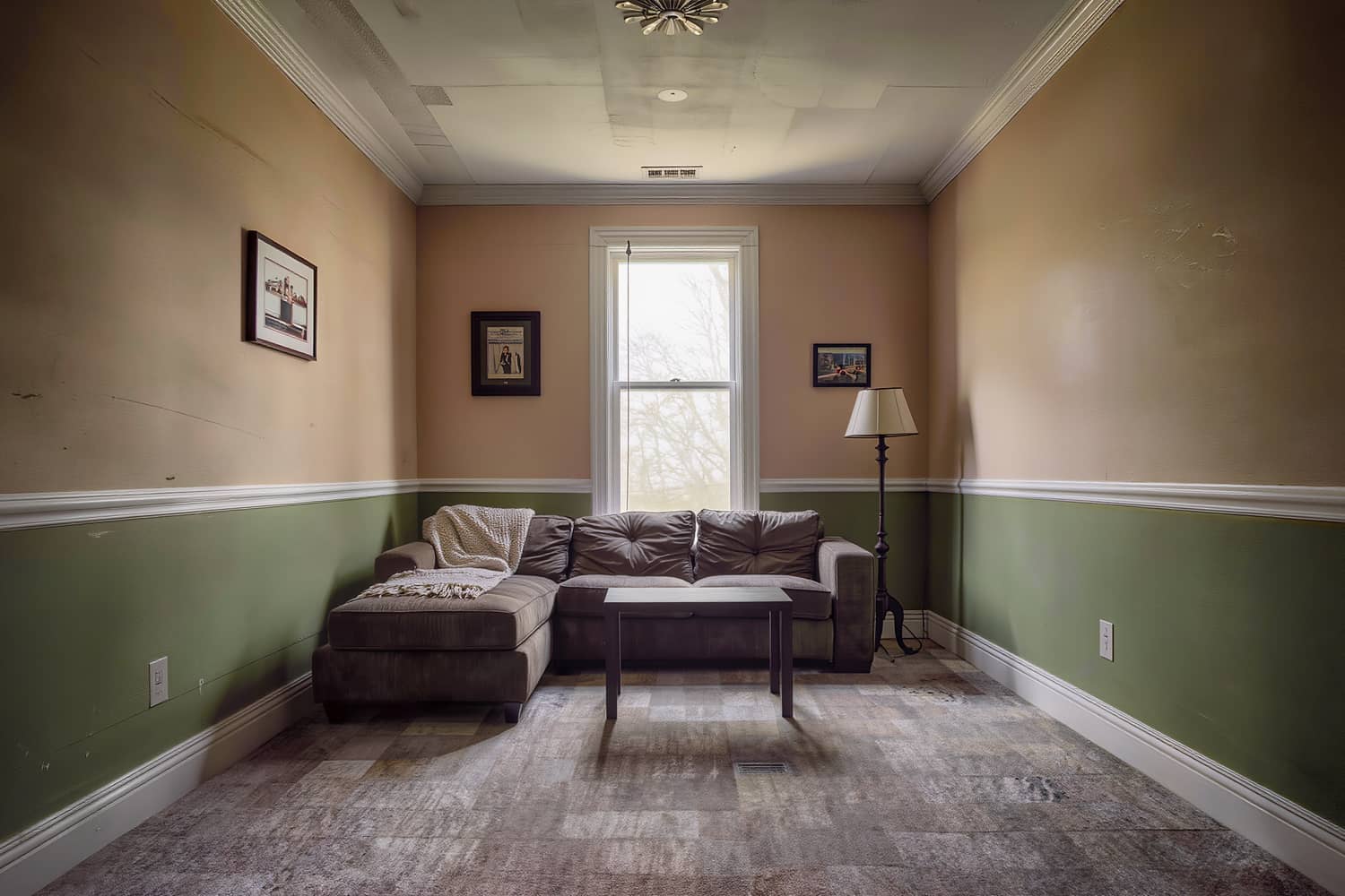 Den with a sectional sofa, squared cushions and clean carpet edges in afternoon light