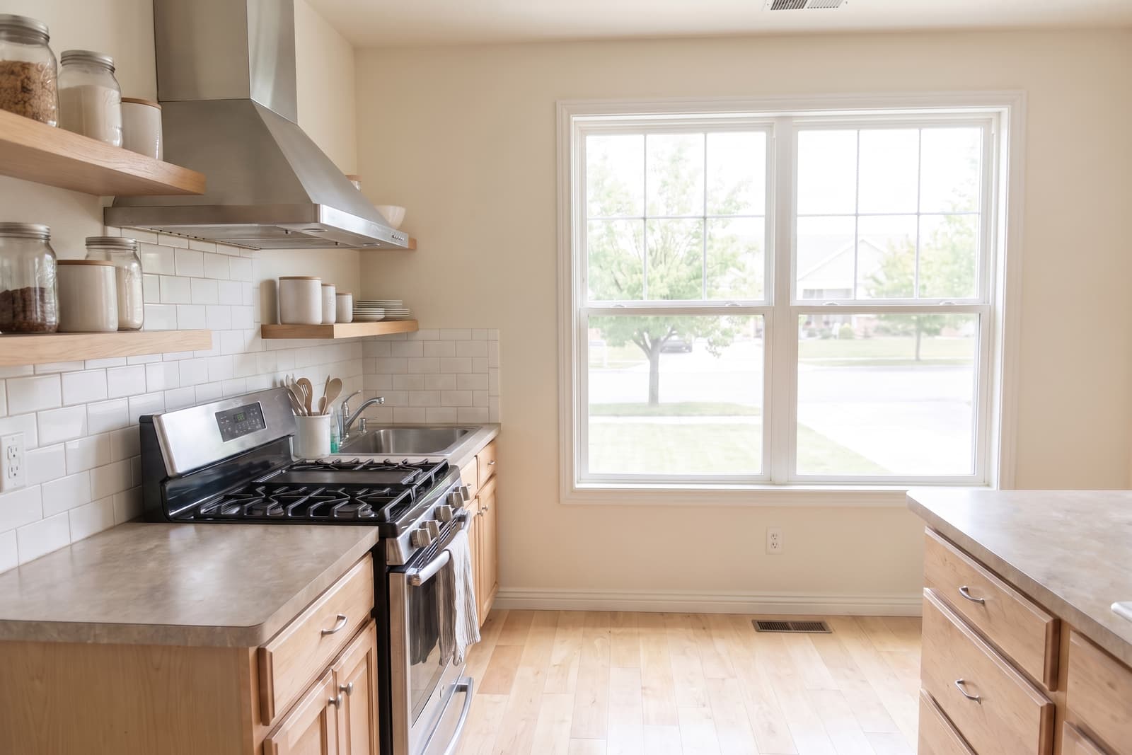 Kitchen after a clean, counters cleared and the range hood degreased