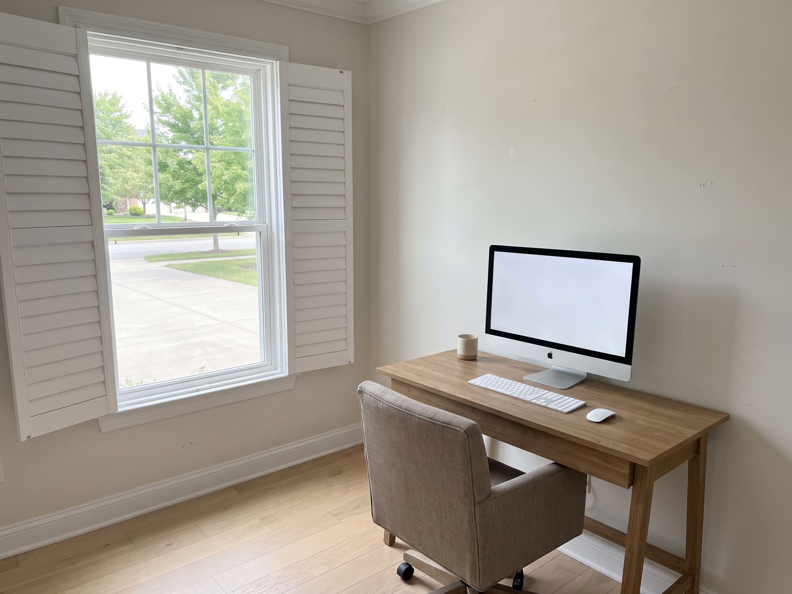 Home office after a clean, desk cleared and dusted and the monitor wiped free of fingerprints